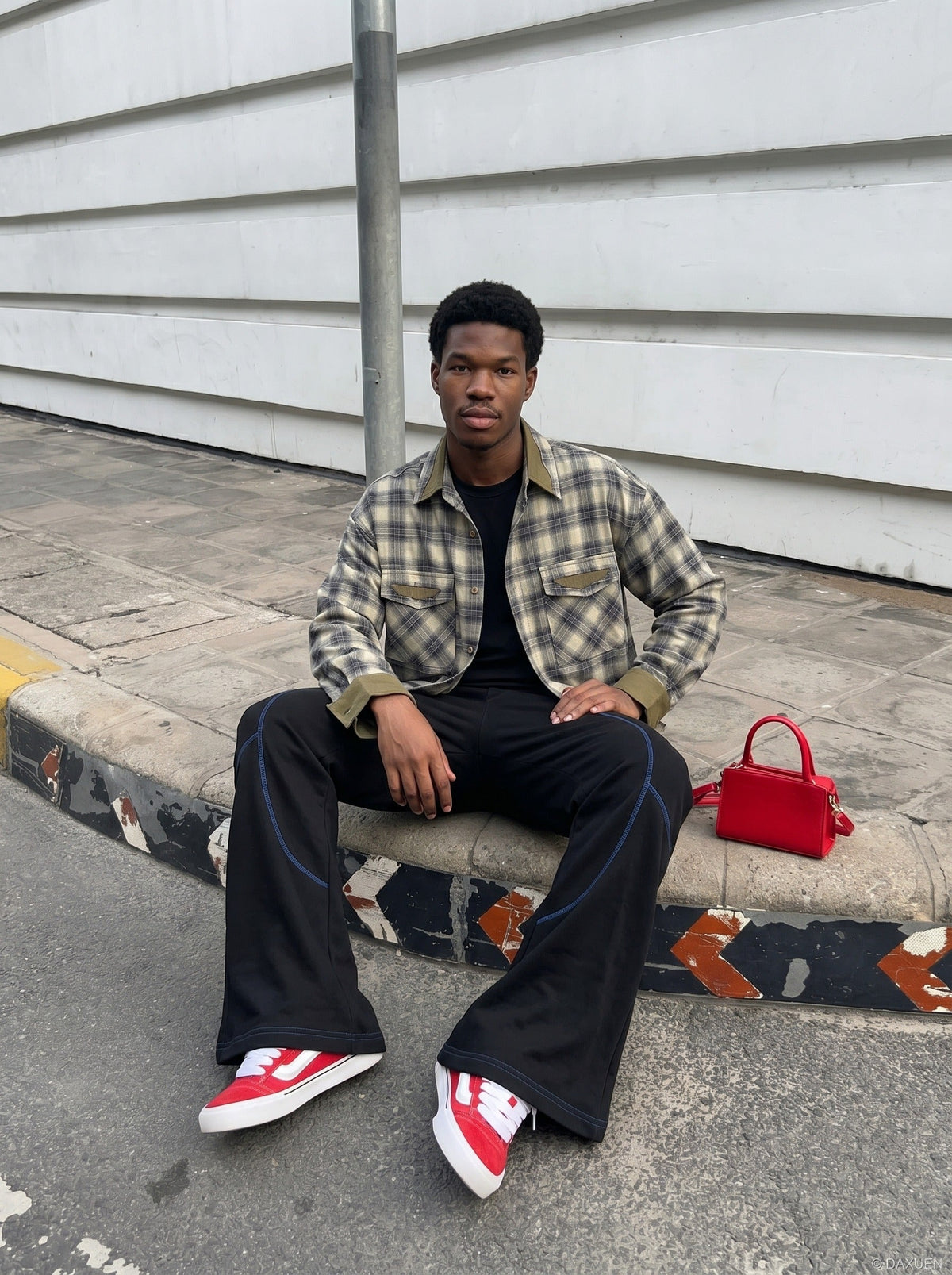 DAXUEN soft matte knit flared pants with contrast stitching — model photo