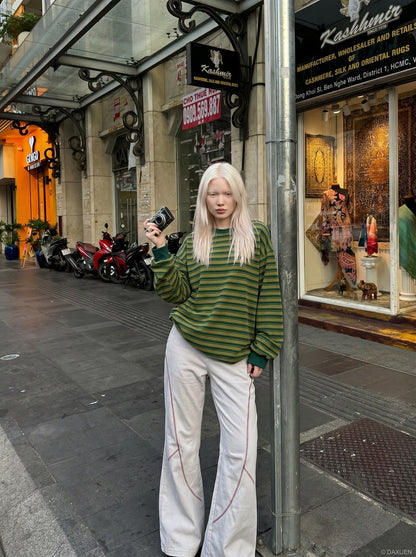 DAXUEN soft matte knit flared pants with contrast stitching — model photo