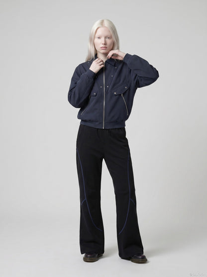 DAXUEN soft matte knit flared pants with contrast stitching — model photo