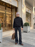 DAXUEN black bomber jacket with curved chest flaps — model photo