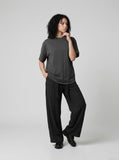 DAXUEN solid grey oversized curved-hem tee — model photo