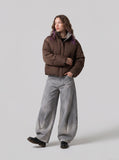 DAXUEN faded grey oversized curved-panel denim pants — model photo