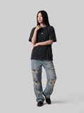 DAXUEN washed black oversized curved-seam emblem tee — model photo