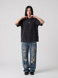 DAXUEN washed black oversized curved-seam emblem tee — model photo