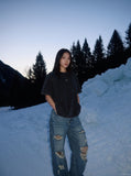 DAXUEN washed black oversized curved-seam emblem tee — model photo
