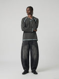 DAXUEN washed black wide-leg denim jeans with curved seams — model photo