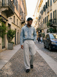 DAXUEN washed black wide-leg sweatpants with distressed back graphic — model photo