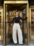 DAXUEN washed black wide-leg sweatpants with distressed back graphic — model photo