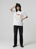 DAXUEN Graphic t-shirt featuring an apple and bear design — model photo