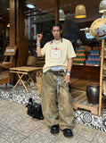 DAXUEN Graphic t-shirt featuring an apple and bear design — model photo