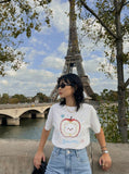 DAXUEN Graphic t-shirt featuring an apple and bear design — model photo