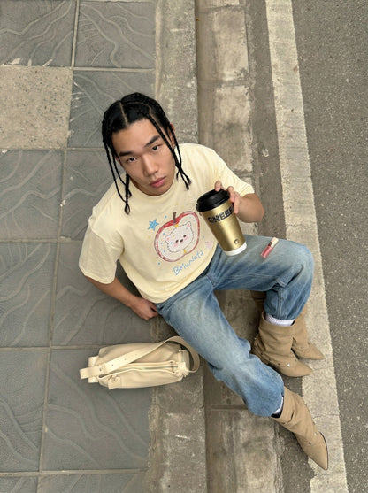 DAXUEN Graphic t-shirt featuring an apple and bear design — model photo