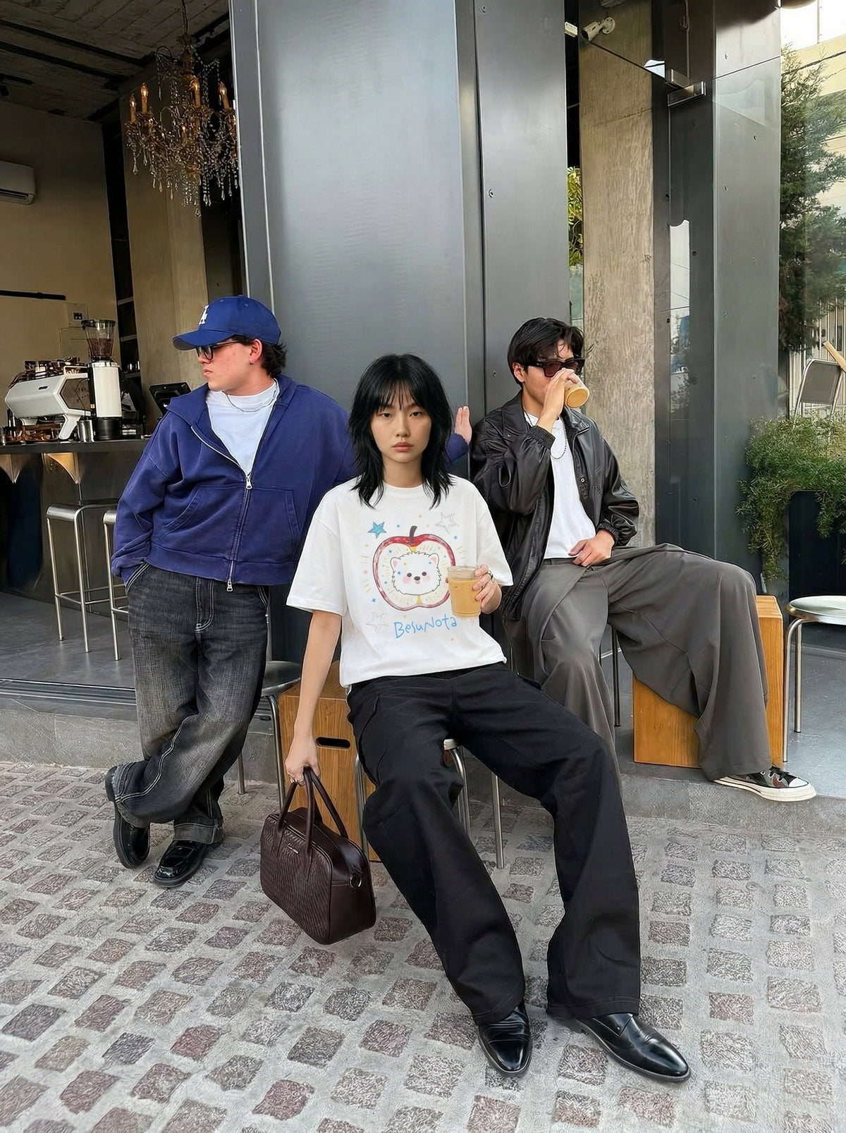 DAXUEN Graphic t-shirt featuring an apple and bear design — model photo