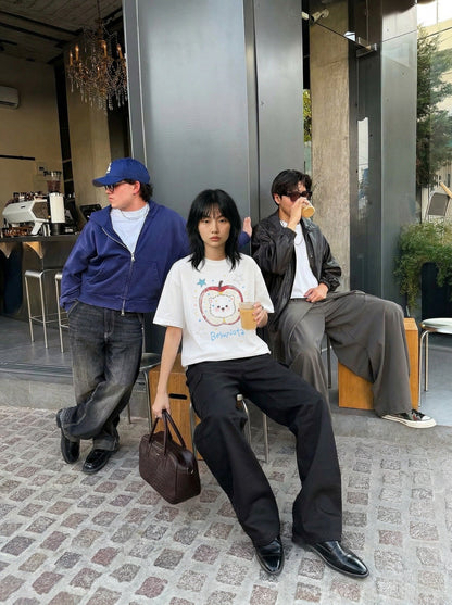 DAXUEN Graphic t-shirt featuring an apple and bear design — model photo