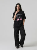 DAXUEN white oversized dachshund graphic tee — model photo