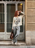 DAXUEN heathered light beige botanical print knit top — model photo