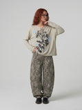 DAXUEN heathered light beige botanical print knit top — model photo