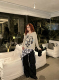 DAXUEN heathered light beige botanical print knit top — model photo
