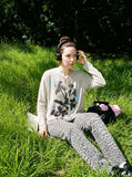 DAXUEN heathered light beige botanical print knit top — model photo