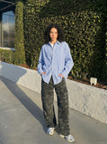 DAXUEN dark green camouflage relaxed cargo pants — model photo