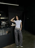 DAXUEN Dark grey women's flared pants with graphic details — model photo