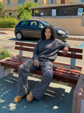 DAXUEN Dark grey women's flared pants with graphic details — model photo