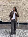 DAXUEN dark grey wide-leg cargo pants with silver spikes — model photo
