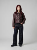 DAXUEN Dark indigo wide-leg denim pants with embroidery and studs — model photo