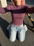 DAXUEN dark plum mock neck athletic top — model photo