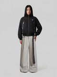 DAXUEN Deconstructed bomber jacket in navy blue and black — model photo