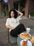 DAXUEN Deconstructed vintage graphic T-shirt — model photo