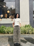 DAXUEN Deconstructed vintage graphic T-shirt — model photo