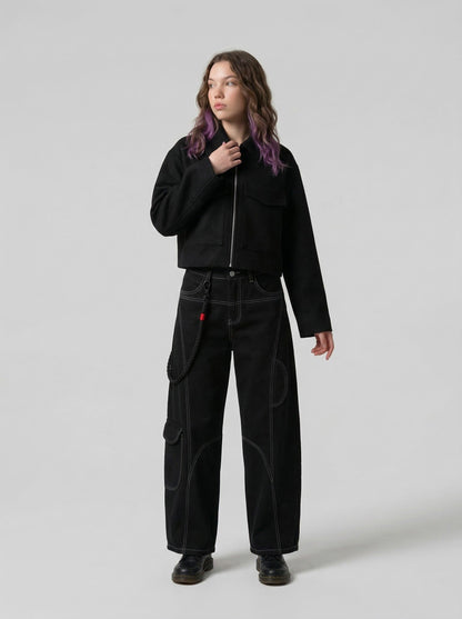 DAXUEN Deconstructed wide-leg trousers with contrasting stitching — model photo