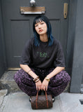 DAXUEN pink oversized digital clock graphic tee — model photo