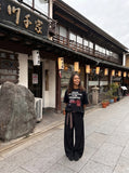 DAXUEN Oversized graphic print black and cream t-shirt — model photo