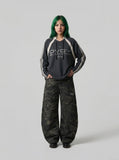 DAXUEN Oversized long sleeve top with bold graphics — model photo