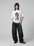 DAXUEN black oversized distorted face graphic tee — model photo