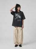 DAXUEN washed black oversized abstract skull graphic tee — model photo