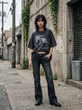 DAXUEN washed black oversized abstract skull graphic tee — model photo