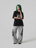DAXUEN black oversized distressed abstract starburst graphic tee — model photo