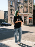 DAXUEN black oversized distressed abstract starburst graphic tee — model photo