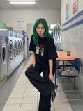 DAXUEN black oversized distressed abstract starburst graphic tee — model photo