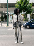 DAXUEN washed grey wide-leg trousers with distressed abstract print — model photo