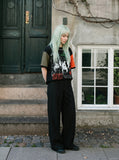 DAXUEN black oversized t-shirt with distressed alphanumeric graphic — model photo