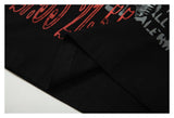 DAXUEN black oversized t-shirt with distressed alphanumeric graphic