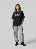 DAXUEN faded light purple oversized 'ANM' graphic tee — model photo