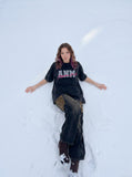 DAXUEN faded light purple oversized 'ANM' graphic tee — model photo