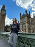 DAXUEN faded light purple oversized 'ANM' graphic tee — model photo