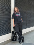 DAXUEN faded light purple oversized 'ANM' graphic tee — model photo