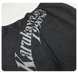 DAXUEN washed black wide-leg sweatpants with distressed back graphic